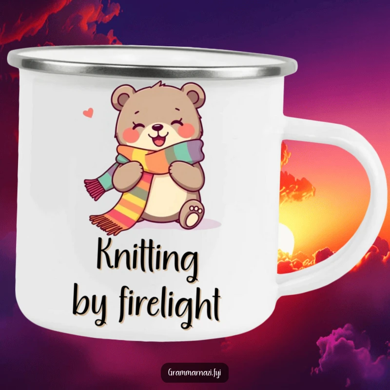 Funny camping mug displaying a joyous bear happily knitting a long, colorful scarf by a campfire.