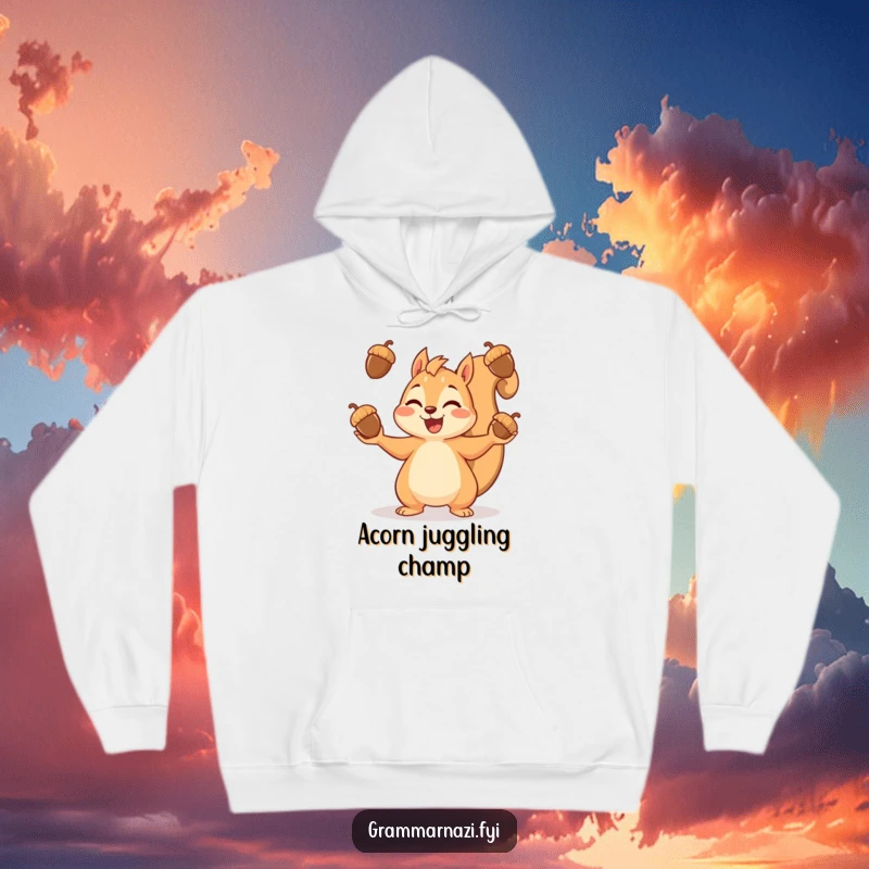 Funny hoodie displaying a content squirrel engrossed in juggling a bounty of acorns, embodying cheerful abundance.