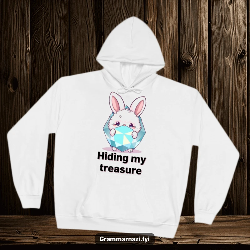 Funny hoodie with a cute bunny peeking from behind a big, sparkling gemstone. Cozy charm.