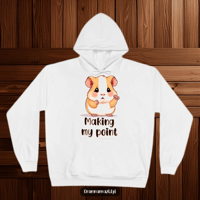 Funny hoodie depicting a determined guinea pig polishing a period, symbolizing a humorous dedication to grammar, a cozy gift.