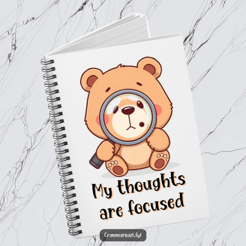 Funny bear with a magnifying glass focused on a comma, symbolizing attention to detail and grammar, on a notebook cover.