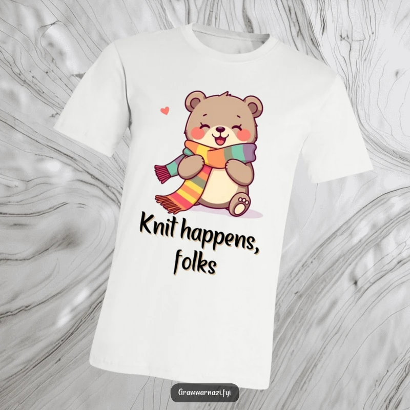 Funny t-shirt featuring a joyous bear happily knitting an extra long, colorful scarf, full of creative bliss.