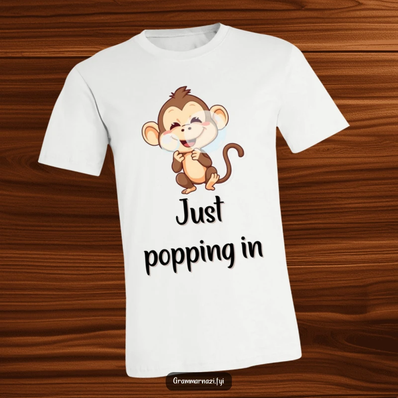 Funny t-shirt featuring a mischievous monkey with a playful grin, blowing a big, shimmering bubble.