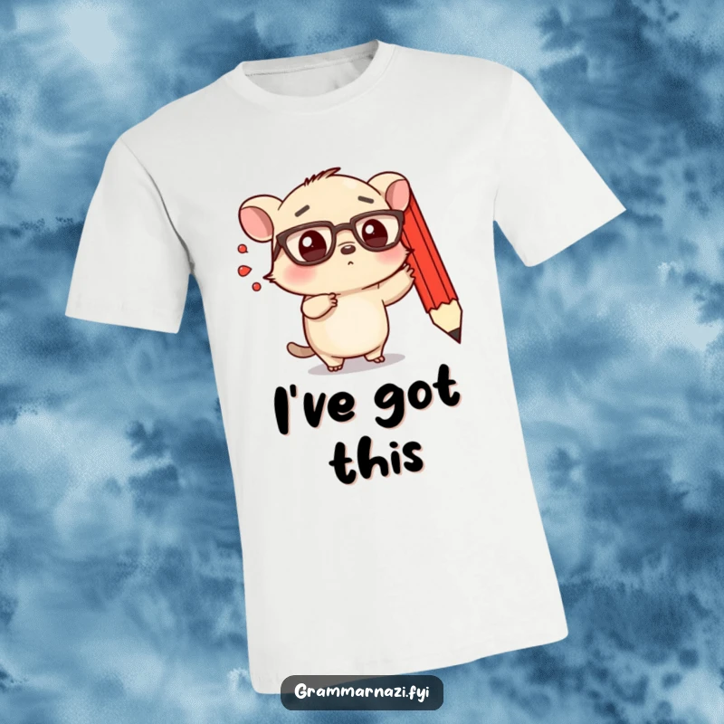 Funny t-shirt showing a small, determined creature with spectacles emphatically pointing at a floating, red pencil.