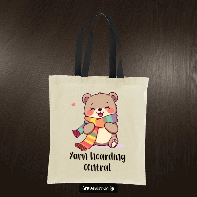 Funny tote bag with a joyous bear happily knitting a long, colorful scarf, perfect for yarn storage.